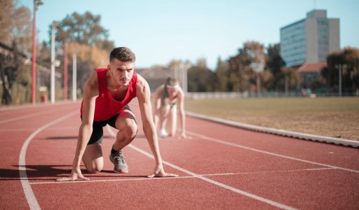 strong sportsmen ready for running on stadium