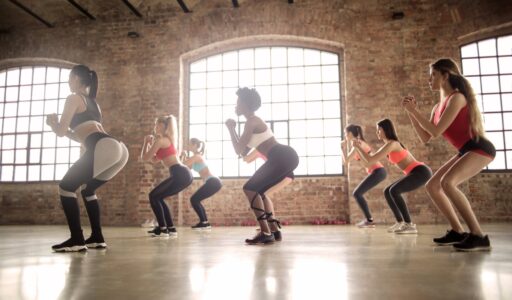 group of women doing exercise inside the building